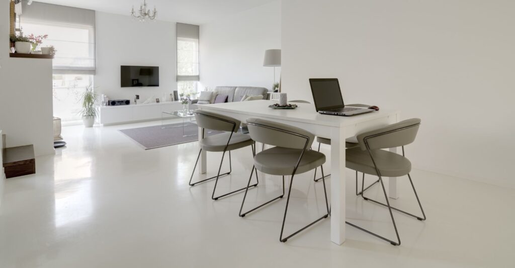 living room and dining room with epoxy flooring